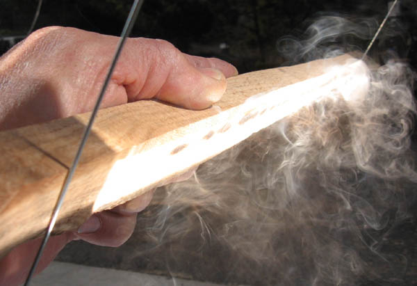 A strip of wood burns instantly at the focal point of the 2x4' AA trough parabolic-click to enlarge